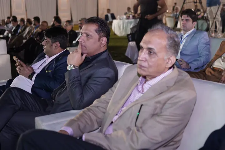 Audience members listening to the formal addresses.